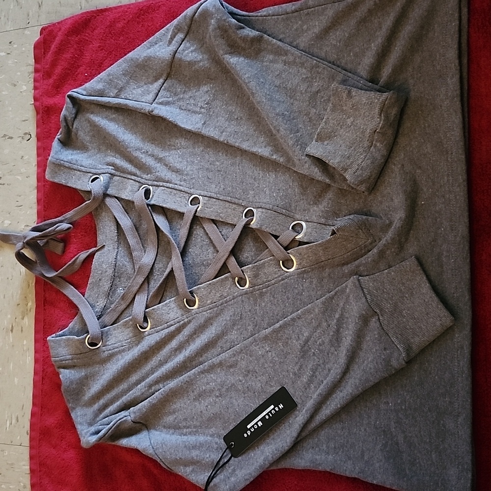 BRAND NEW SWEATER LACE UP FRONT. SIZE MEDIUM